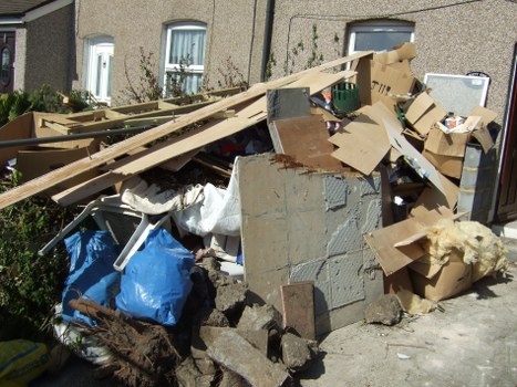 Wide variety of furniture being cleared from a residential space